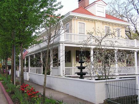 East View of Mansion/Bed & Breakfast showing garden & fountain with Apple Tree.